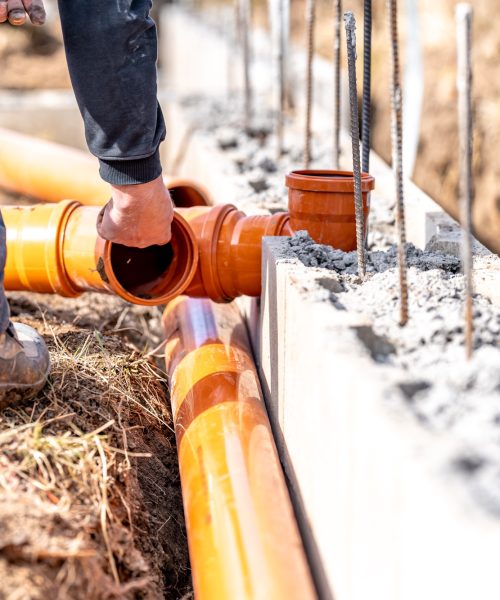 installation of a sewage plastic pipe during the construction of a house